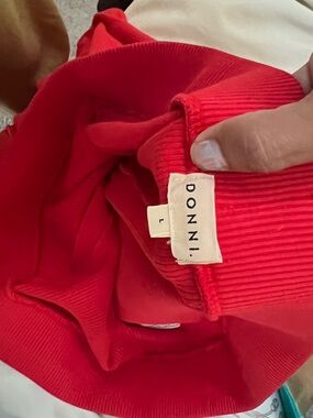 DONNI. Vibrant Red kick flares